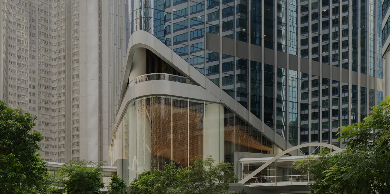 Sculptural podium architecture and greenery at Two Sudirman